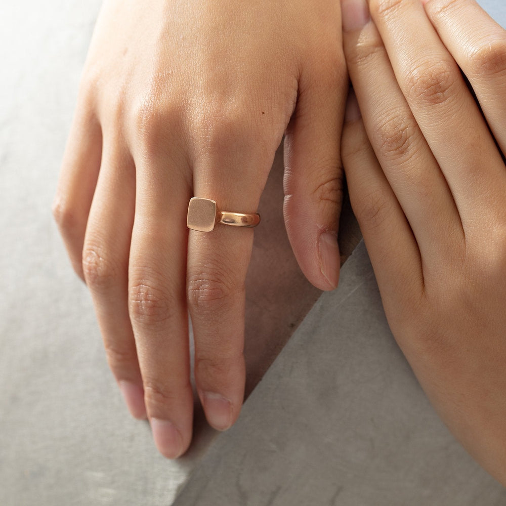 
                      
                        Close-up view of model wearing Square Signet Ring - Rose, by Betsy Barron Jewellery, on right index finger.
                      
                    