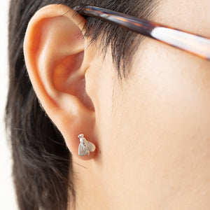 
            
                Load image into Gallery viewer, Model wearing Petite Abeille earrings in right ear
            
        