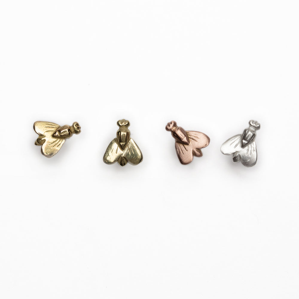 Four Petite Abeille earrings in various metals