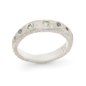 
            
                Load image into Gallery viewer, Narrow Molten Band in sterling silver with green Gemstones
            
        