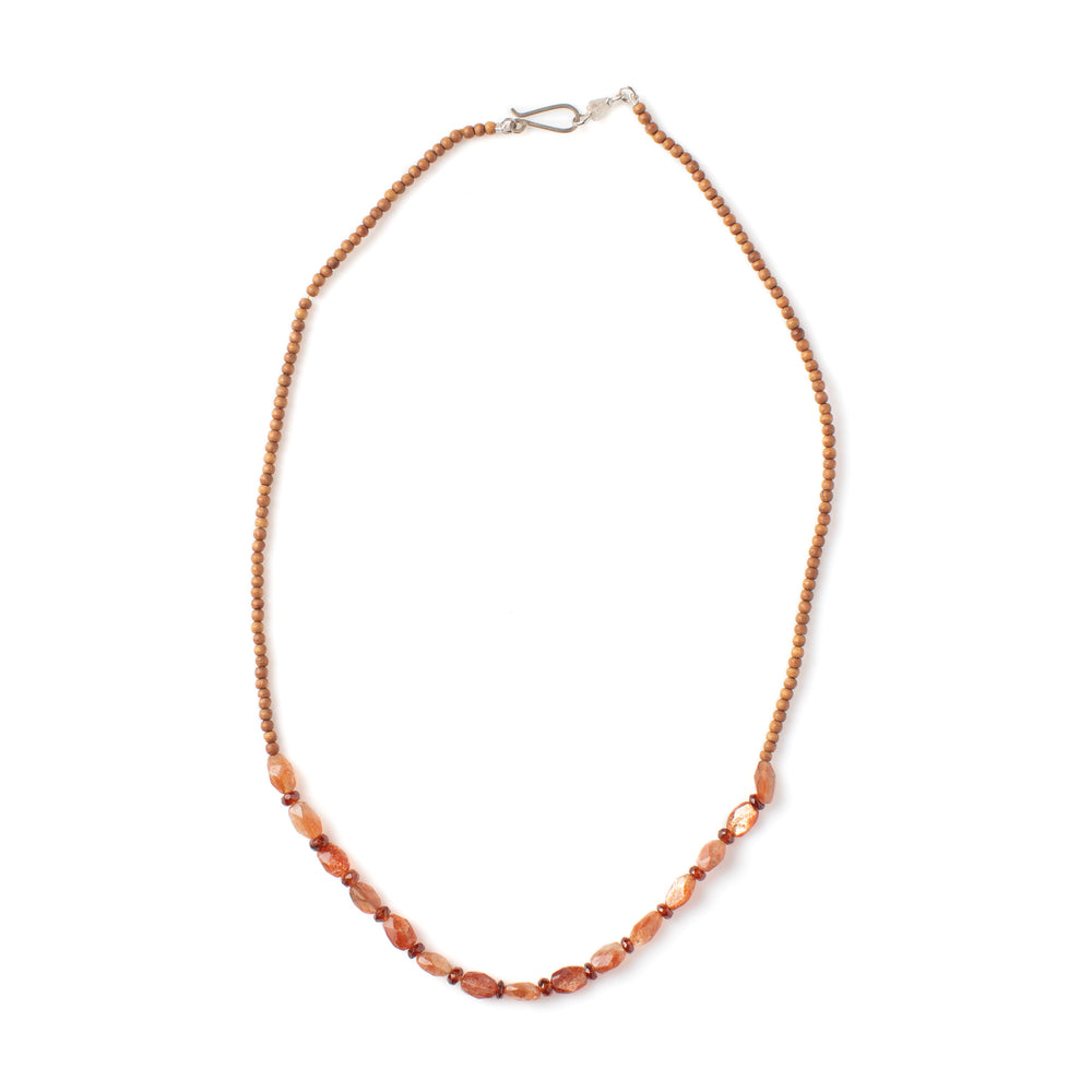 Top-down view of Vacation Necklace with goldstone garnet beads